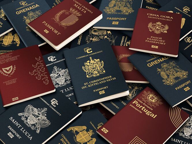 Various country passports on top of each other in a pile. Passports are shown with blue and red covers and countries include St Lucia, Portuagal, and Malta