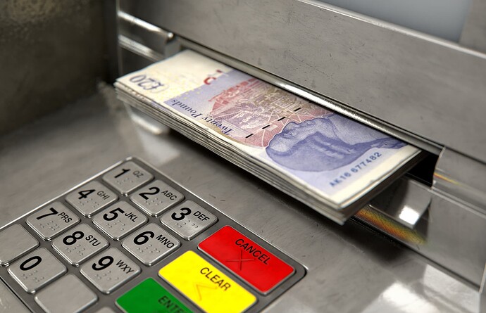 Twenty pound notes being dispensed at an ATM