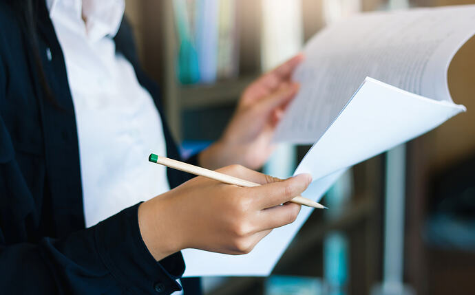 A woman looking at financial papers